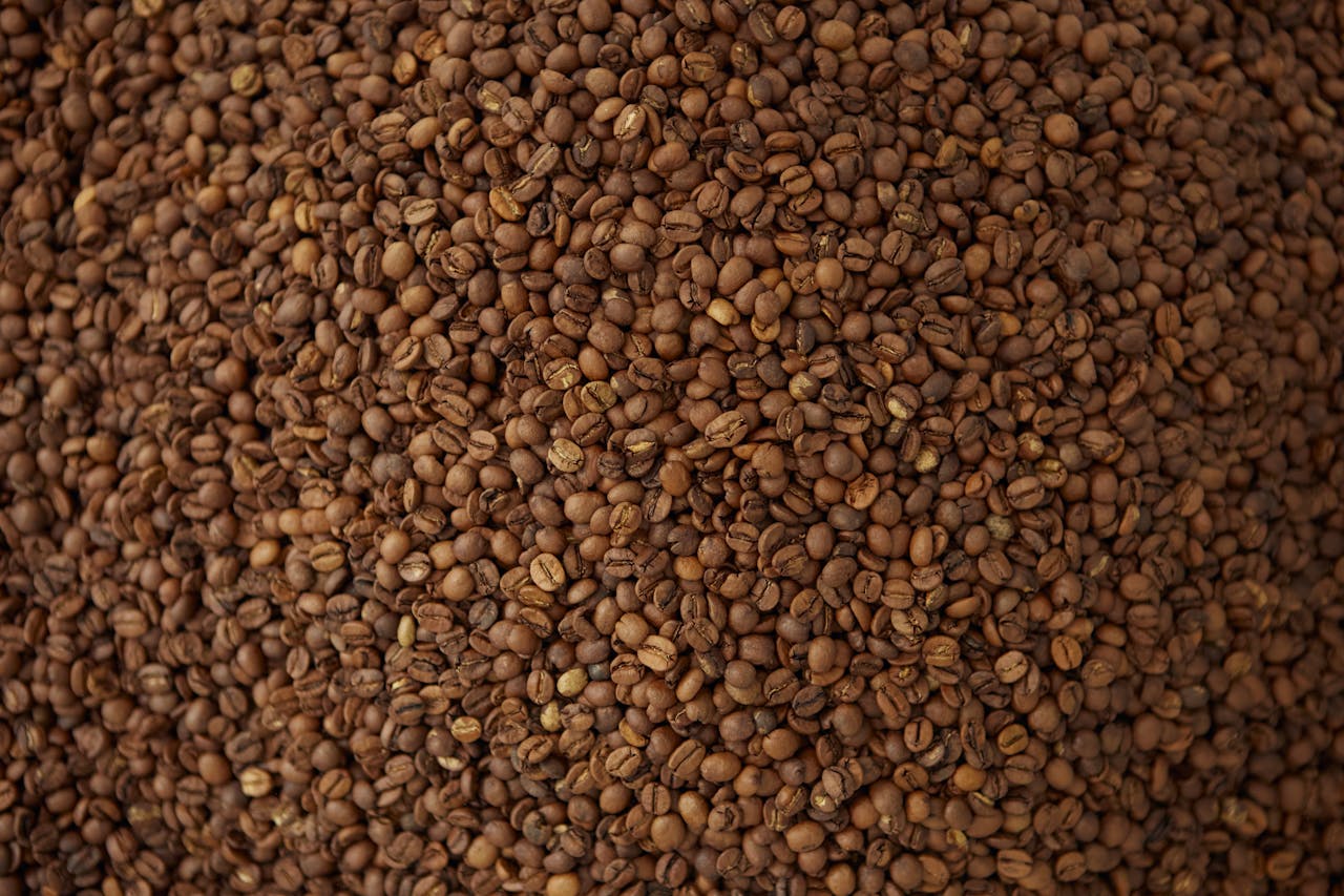 heros-img An artistic close-up of freshly roasted coffee beans, ideal for café themes.
